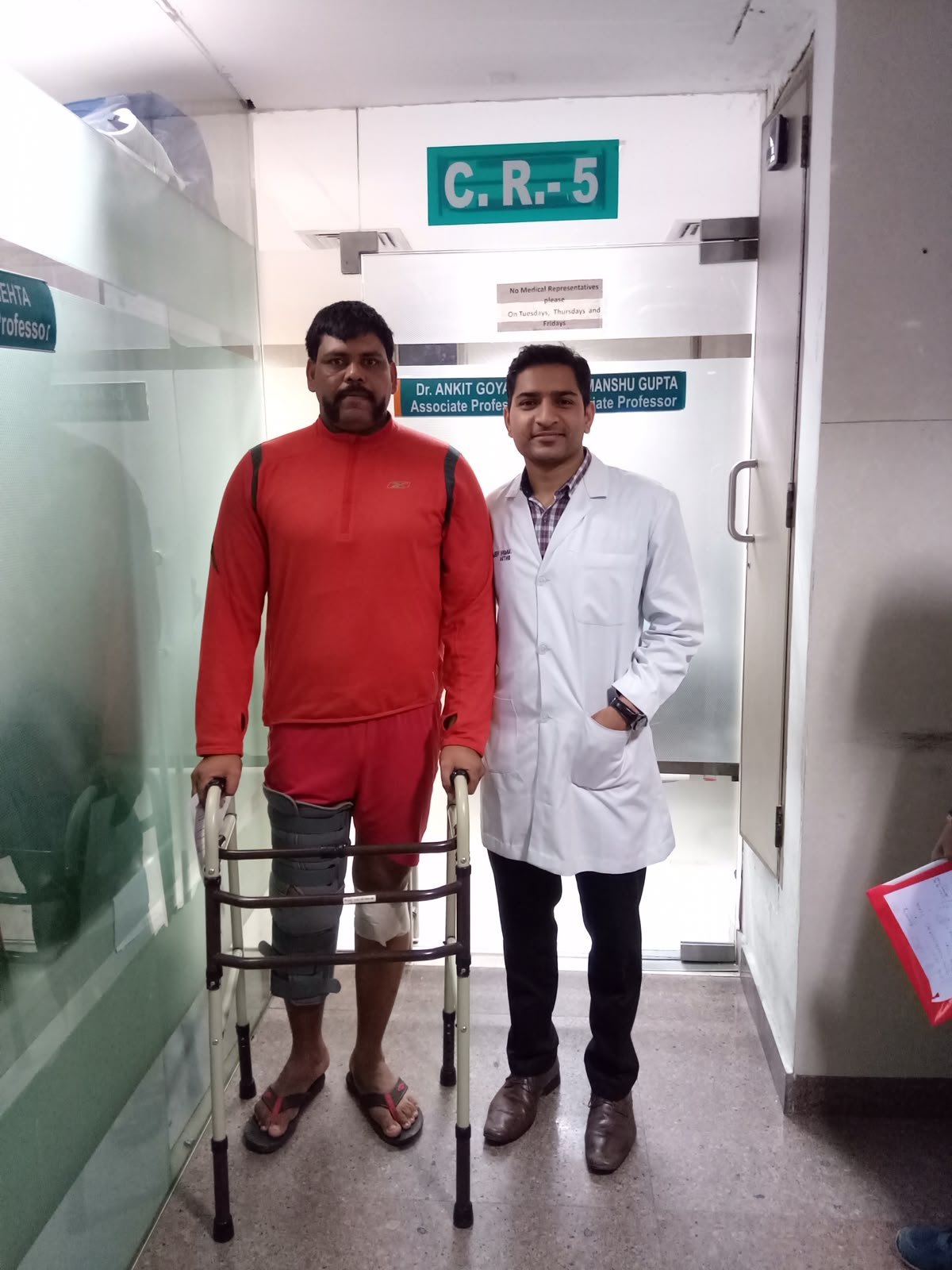 Dr. Sanjeev Kumar with a national-level kushti player.